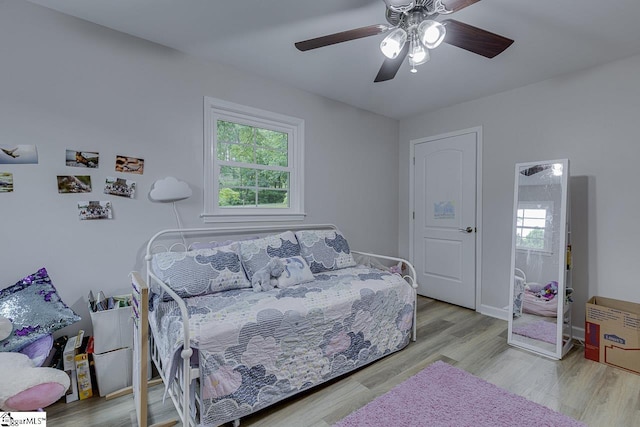 9 Mountain Brook Trl, Greenville, SC 29609 - bedroom with multiple windows, wood finished floors, a ceiling fan, and baseboards
