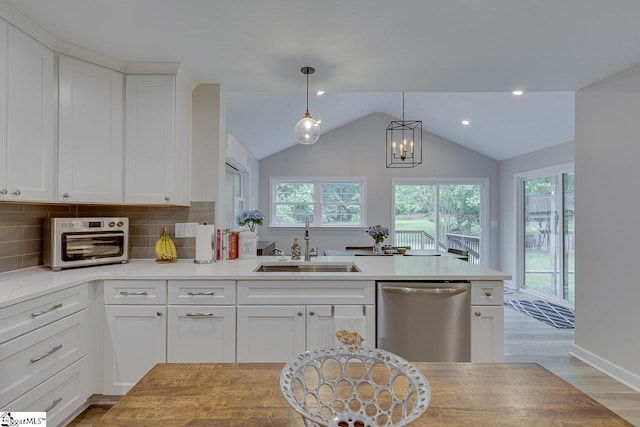 9 Mountain Brook Trl, Greenville, SC 29609 - kitchen featuring dishwasher, a sink, healthy amount of natural light, light countertops, and lofted ceiling