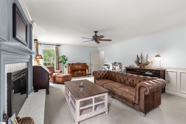 109 Appomattox Dr, Simpsonville, SC 29681 - living room with a ceiling fan, ornamental molding, a glass covered fireplace, light carpet, and a decorative wall