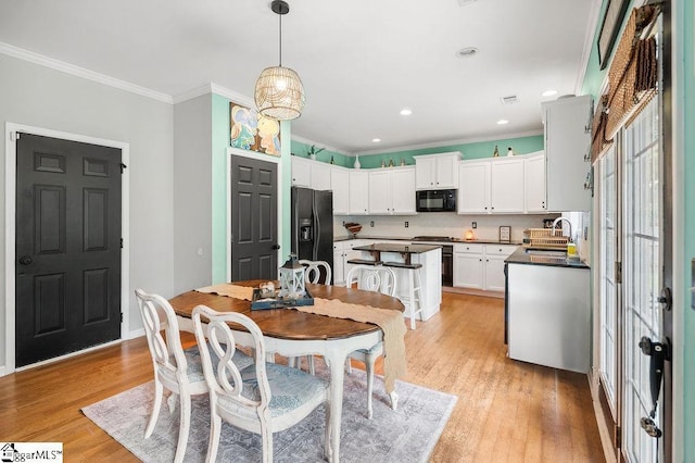 9 Peninsula Ct, Simpsonville, SC 29681 - dining space featuring ornamental molding, light wood-type flooring, and recessed lighting