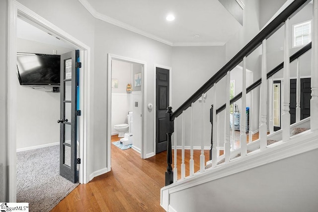 9 Peninsula Ct, Simpsonville, SC 29681 - corridor with wood finished floors, ornamental molding, stairs, baseboards, and recessed lighting