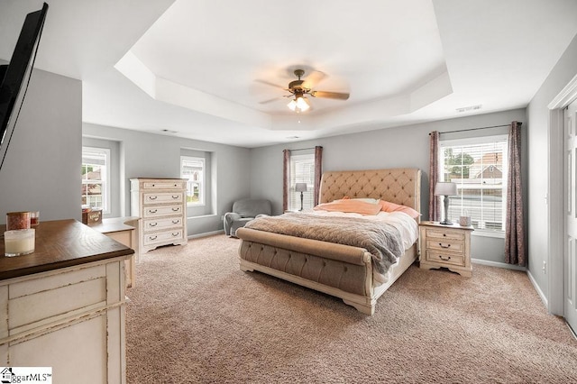 9 Peninsula Ct, Simpsonville, SC 29681 - bedroom featuring a tray ceiling, light colored carpet, baseboards, and ceiling fan