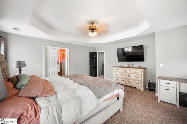 9 Peninsula Ct, Simpsonville, SC 29681 - bedroom featuring a tray ceiling, light colored carpet, a ceiling fan, and baseboards