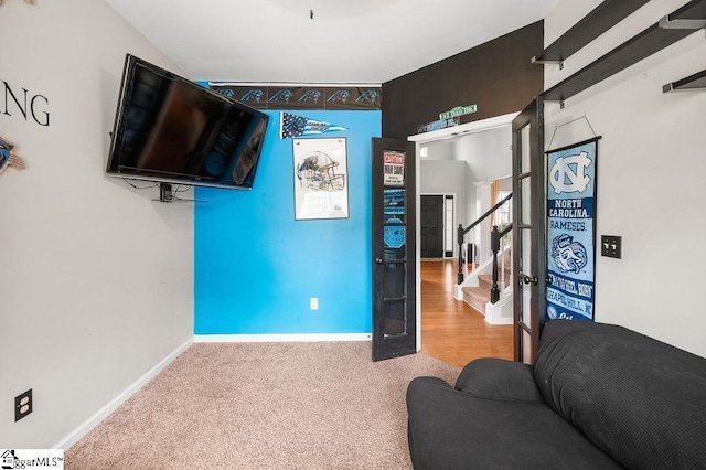 9 Peninsula Ct, Simpsonville, SC 29681 - carpeted living area featuring stairs and baseboards