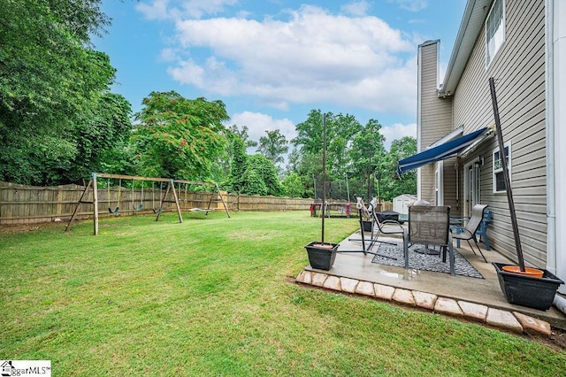 9 Peninsula Ct, Simpsonville, SC 29681 - view of yard featuring a trampoline, a patio area, a playground, and view of scattered trees
