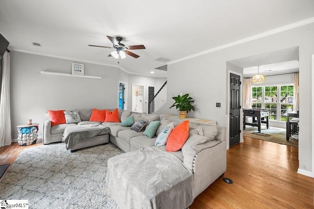 9 Peninsula Ct, Simpsonville, SC 29681 - living room with stairs, wood finished floors, a ceiling fan, and ornamental molding