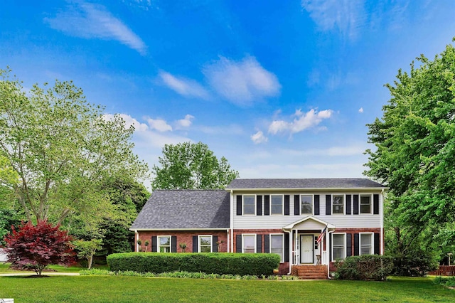 230 Donegal Dr, Moore, SC 29369 - view of front of home featuring brick siding, a front lawn, and roof with shingles