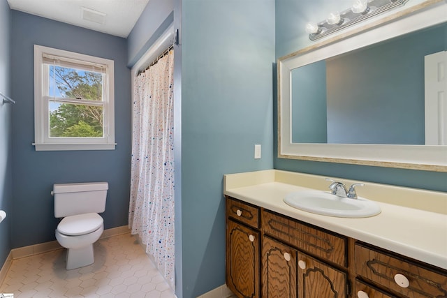 230 Donegal Dr, Moore, SC 29369 - full bath featuring vanity, toilet, baseboards, tile patterned flooring, and a shower with curtain