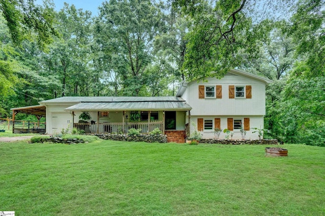 405 Wilson Bridge Rd, Simpsonville, SC 29680 - tri-level home featuring a porch, a front lawn, an attached carport, and metal roof