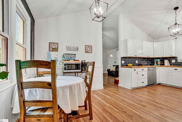 405 Wilson Bridge Rd, Simpsonville, SC 29680 - dining space featuring a chandelier, vaulted ceiling, and light wood-type flooring
