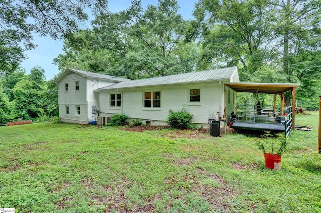 405 Wilson Bridge Rd, Simpsonville, SC 29680 - rear view of house featuring a lawn and central AC