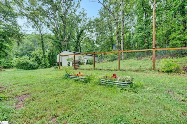 405 Wilson Bridge Rd, Simpsonville, SC 29680 - view of green lawn with an outdoor structure and a detached garage