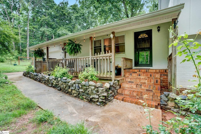 405 Wilson Bridge Rd, Simpsonville, SC 29680 - view of front facade featuring covered porch and brick siding