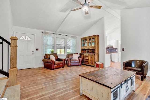 405 Wilson Bridge Rd, Simpsonville, SC 29680 - living room featuring beam ceiling, a ceiling fan, light wood-style flooring, stairway, and high vaulted ceiling