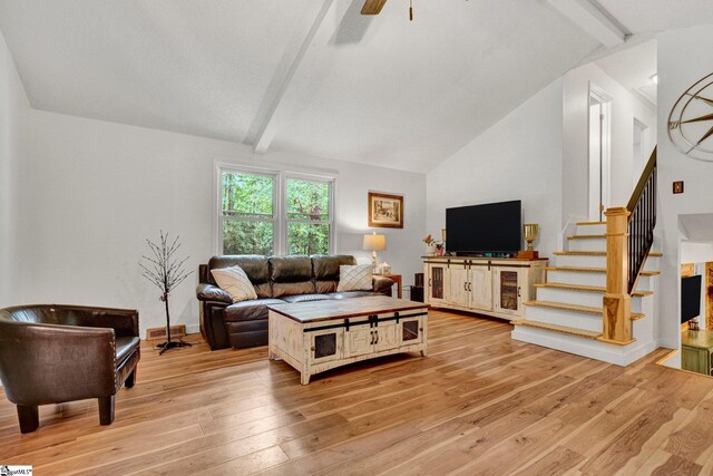 405 Wilson Bridge Rd, Simpsonville, SC 29680 - living room with beamed ceiling, light wood finished floors, stairs, a ceiling fan, and high vaulted ceiling