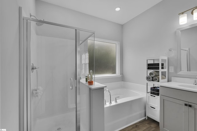 4250 Winding Ridge Ln, Boiling Springs, SC 29316 - bathroom with a shower stall, vanity, a garden tub, and wood finished floors