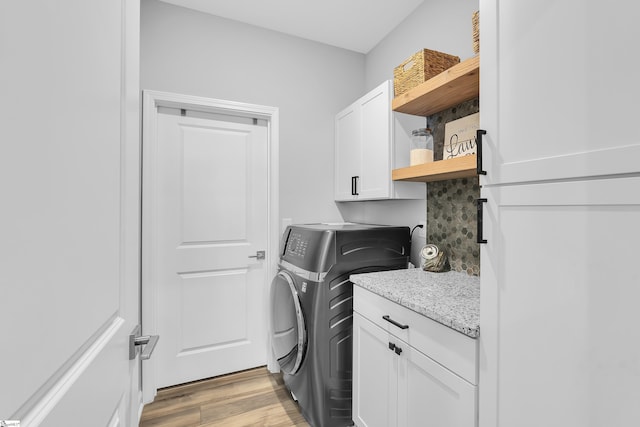 4250 Winding Ridge Ln, Boiling Springs, SC 29316 - laundry room with cabinet space, light wood finished floors, and separate washer and dryer