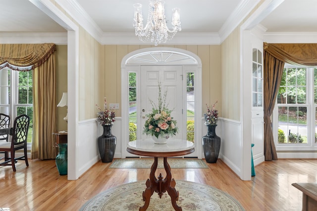 119 Oak Crest Cir, Seneca, SC 29672 - entryway featuring a chandelier, crown molding, light wood-style floors, a decorative wall, and baseboards