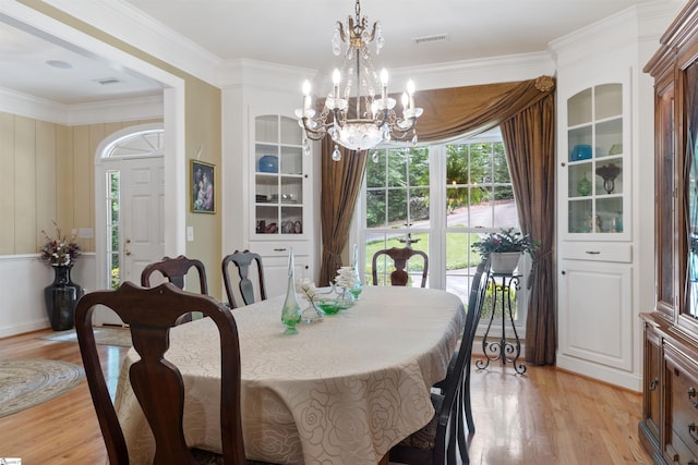 119 Oak Crest Cir, Seneca, SC 29672 - dining area featuring a chandelier, light wood-style flooring, and ornamental molding