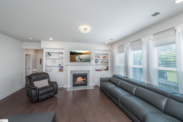 116 Quiet Creek Ct, Simpsonville, SC 29681 - living room featuring a fireplace, baseboards, dark wood-style floors, built in shelves, and recessed lighting