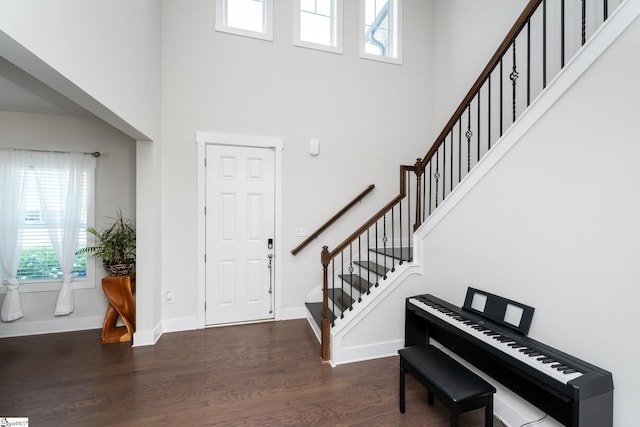 116 Quiet Creek Ct, Simpsonville, SC 29681 - entrance foyer with a towering ceiling, dark wood-style floors, stairway, and baseboards