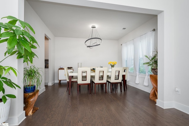 116 Quiet Creek Ct, Simpsonville, SC 29681 - dining area with dark wood-style floors, a chandelier, and baseboards