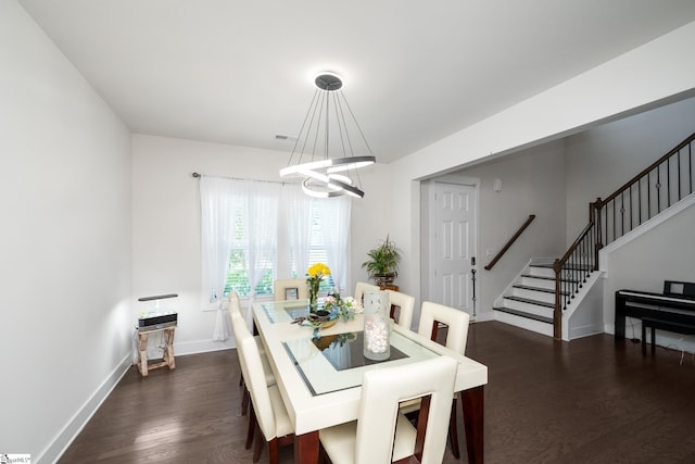 116 Quiet Creek Ct, Simpsonville, SC 29681 - dining area with stairs, dark wood-style flooring, a chandelier, and baseboards
