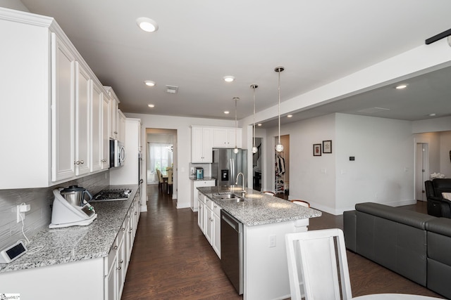 116 Quiet Creek Ct, Simpsonville, SC 29681 - kitchen featuring a sink, appliances with stainless steel finishes, open floor plan, tasteful backsplash, and recessed lighting