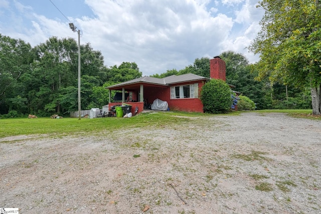 1504 E Rutherford St, Landrum, SC 29356 - ranch-style house with a chimney