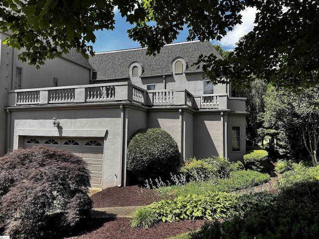 100 Castellan Dr, Greer, SC 29650 - french country style house featuring a balcony, stucco siding, and a garage