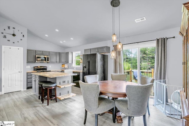 251 Heatherbrook Dr, Lyman, SC 29365 - dining area featuring lofted ceiling, light wood-style floors, and recessed lighting