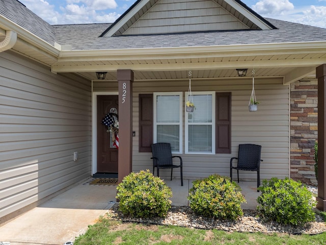 825 Brennan Way, Lyman, SC 29365 - view of exterior entry featuring roof with shingles and covered porch