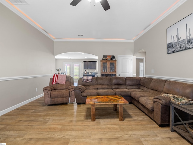 825 Brennan Way, Lyman, SC 29365 - living room with arched walkways, ornamental molding, ceiling fan, and light wood-style flooring