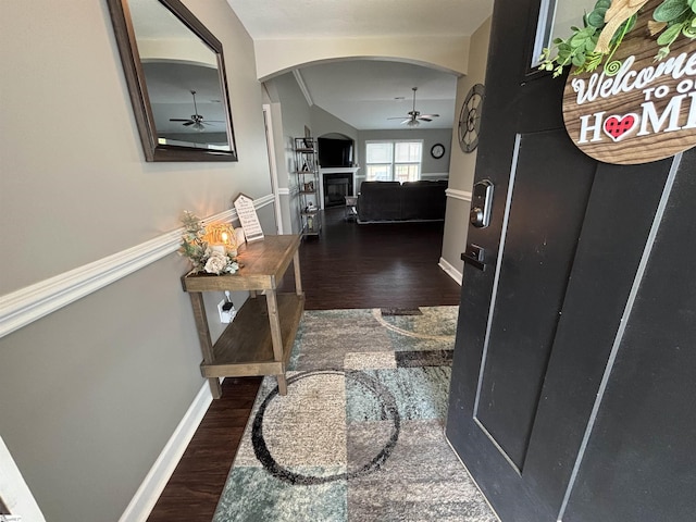 844 Brennan Way, Lyman, SC 29365 - hallway featuring dark wood-type flooring, arched walkways, and baseboards