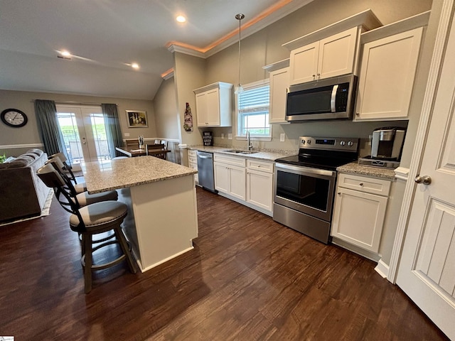 844 Brennan Way, Lyman, SC 29365 - kitchen with appliances with stainless steel finishes, a sink, french doors, white cabinetry, and a kitchen island