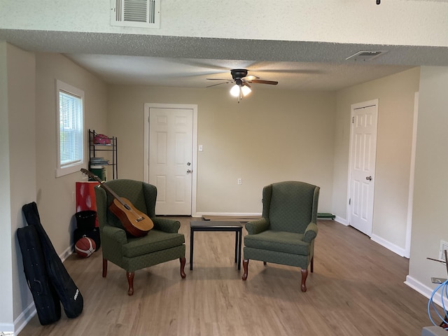 407 Old Farm Rd, Moore, SC 29539 - sitting room with wood finished floors, a ceiling fan, baseboards, and a textured ceiling