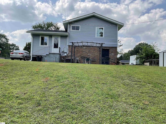 407 Old Farm Rd, Moore, SC 29539 - back of house featuring a pergola, a lawn, and brick siding