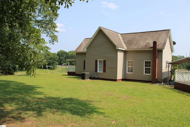 295 Dorn St, Westminster, SC 29693 - back of house with a yard, central air condition unit, and roof with shingles