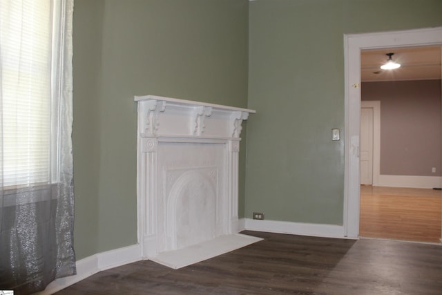 295 Dorn St, Westminster, SC 29693 - spare room featuring a fireplace, wood finished floors, and baseboards