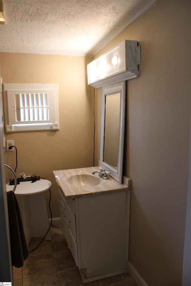 295 Dorn St, Westminster, SC 29693 - bathroom with vanity, a textured ceiling, tile patterned flooring, and baseboards