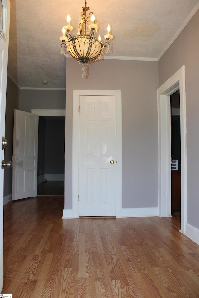 295 Dorn St, Westminster, SC 29693 - unfurnished dining area featuring a chandelier, ornamental molding, wood finished floors, and baseboards