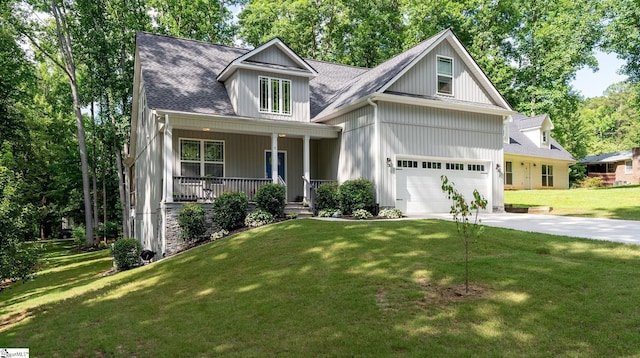 8 Spur Dr, Travelers Rest, SC 29690 - view of front of home with a porch, driveway, a front lawn, and a shingled roof