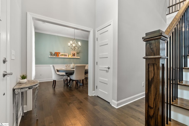 8 Spur Dr, Travelers Rest, SC 29690 - foyer entrance with a chandelier, ornamental molding, dark wood-type flooring, and baseboards