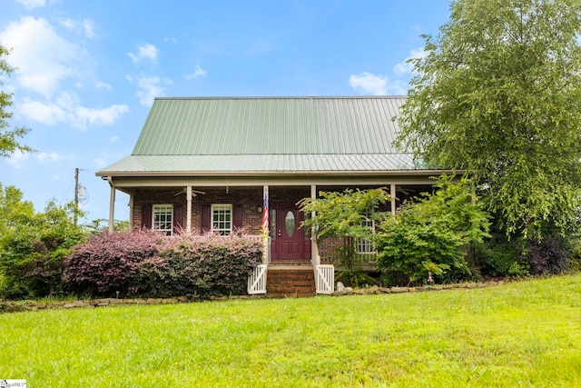 1847 Bertha Knight Rd, Lancaster, SC 29720 - view of front of house featuring a front lawn, covered porch, and metal roof