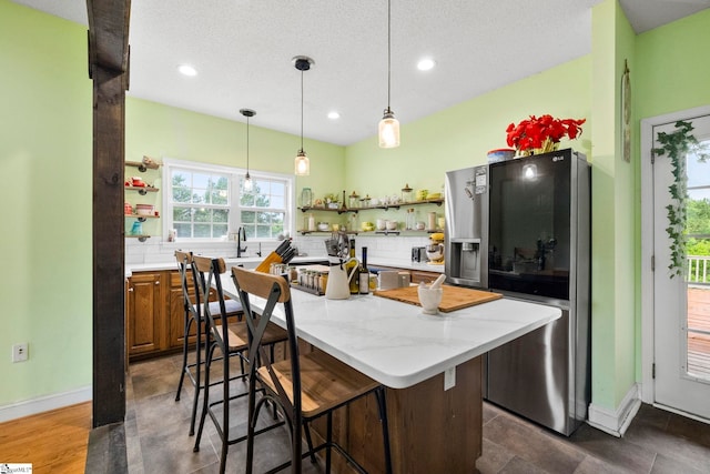 1847 Bertha Knight Rd, Lancaster, SC 29720 - kitchen featuring open shelves, stainless steel fridge, decorative backsplash, recessed lighting, and brown cabinets