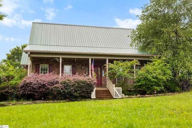 1847 Bertha Knight Rd, Lancaster, SC 29720 - view of front of property featuring a front yard, covered porch, brick siding, and metal roof