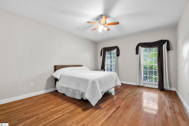1847 Bertha Knight Rd, Lancaster, SC 29720 - bedroom with light wood finished floors, baseboards, and a ceiling fan