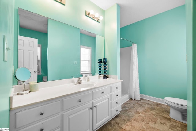 1847 Bertha Knight Rd, Lancaster, SC 29720 - bathroom with vanity, toilet, a shower with shower curtain, baseboards, and stone finish floors
