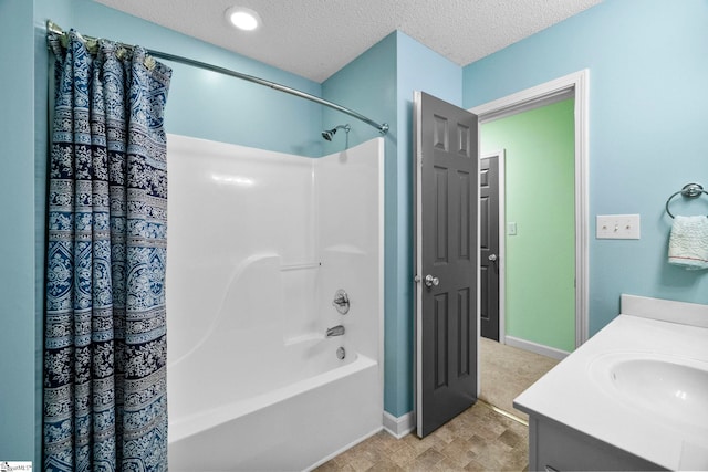 1847 Bertha Knight Rd, Lancaster, SC 29720 - bathroom with vanity, shower / bath combo with shower curtain, a textured ceiling, and baseboards