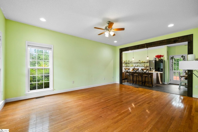 1847 Bertha Knight Rd, Lancaster, SC 29720 - unfurnished living room with ceiling fan, hardwood / wood-style floors, baseboards, and recessed lighting